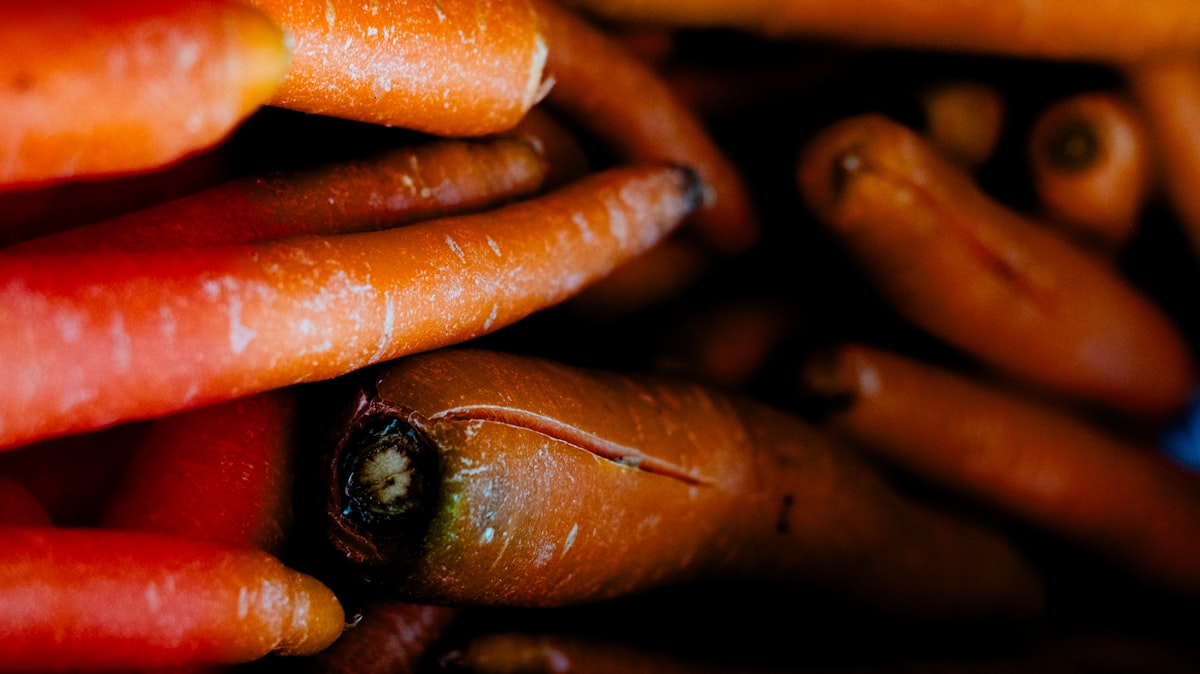 Whole and sliced carrots showing beta-carotene content